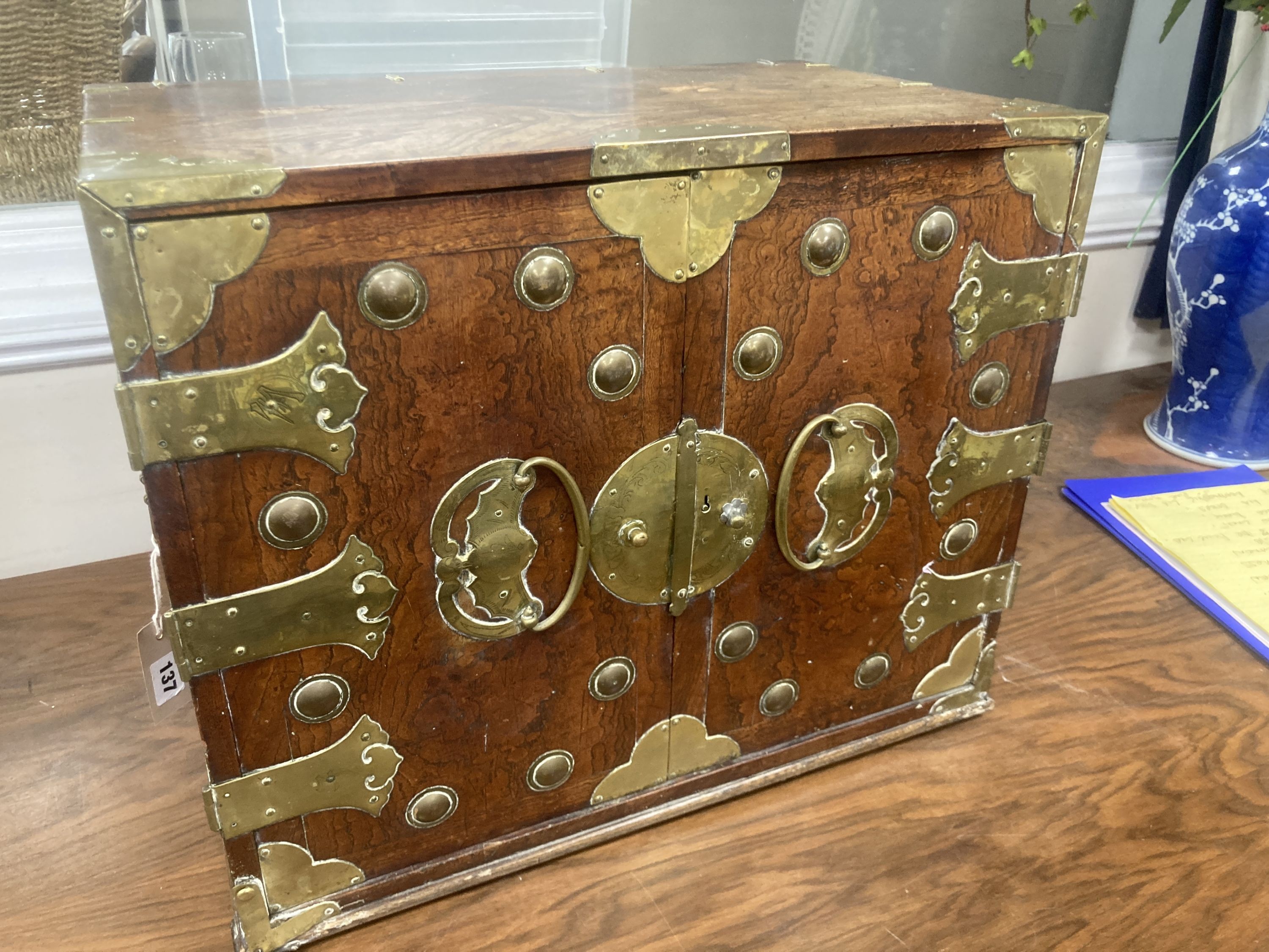 A Korean brass-bound elm small cabinet, H 43cm W 54cm x D 32.5cm